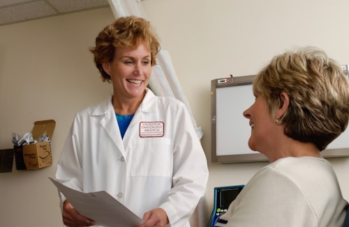 Physician speaking with a patient during a consultation at J9 Clinic in Houston