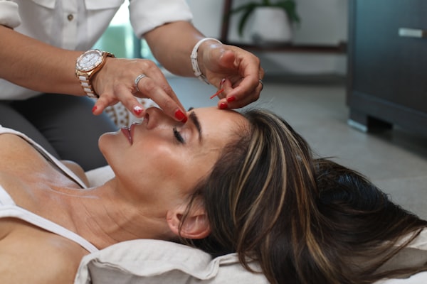 Patient receiving a relaxing facial treatment at J9 Clinic in Houston